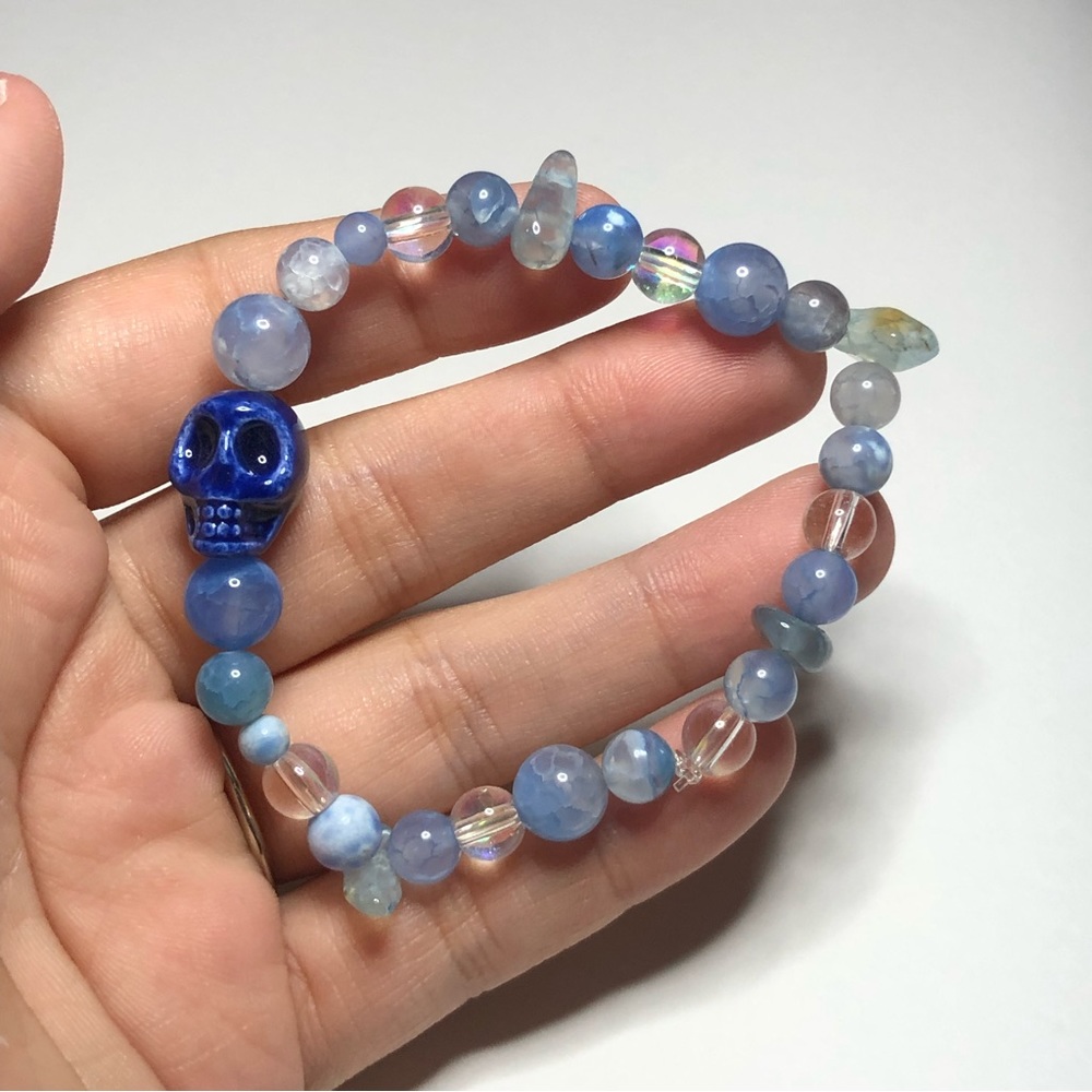 Skull with blue lace agate gems.